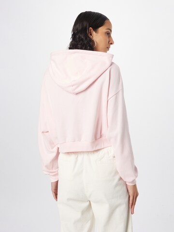 LEVI'S ® Collegepaita 'Graphic Laundry Hoodie' värissä vaaleanpunainen