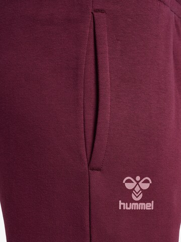 Effilé Pantalon de sport Hummel en rouge
