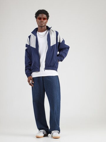 ADIDAS ORIGINALS - Chaqueta de entretiempo en azul