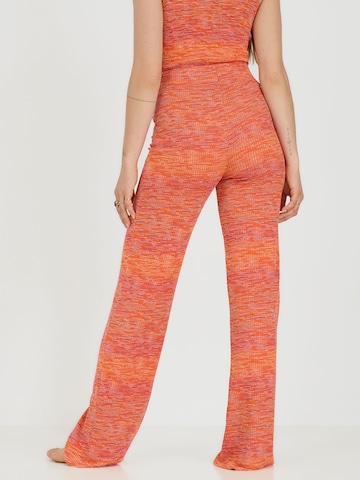 ABOUT YOU x Sofia Tsakiridou Loose fit Pants 'Lia' in Orange