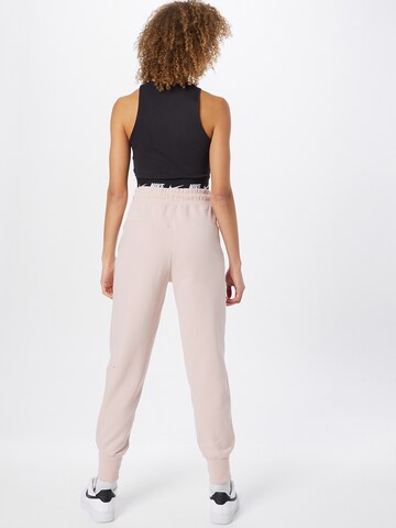 Nike Sportswear Tapered Hose in Pink