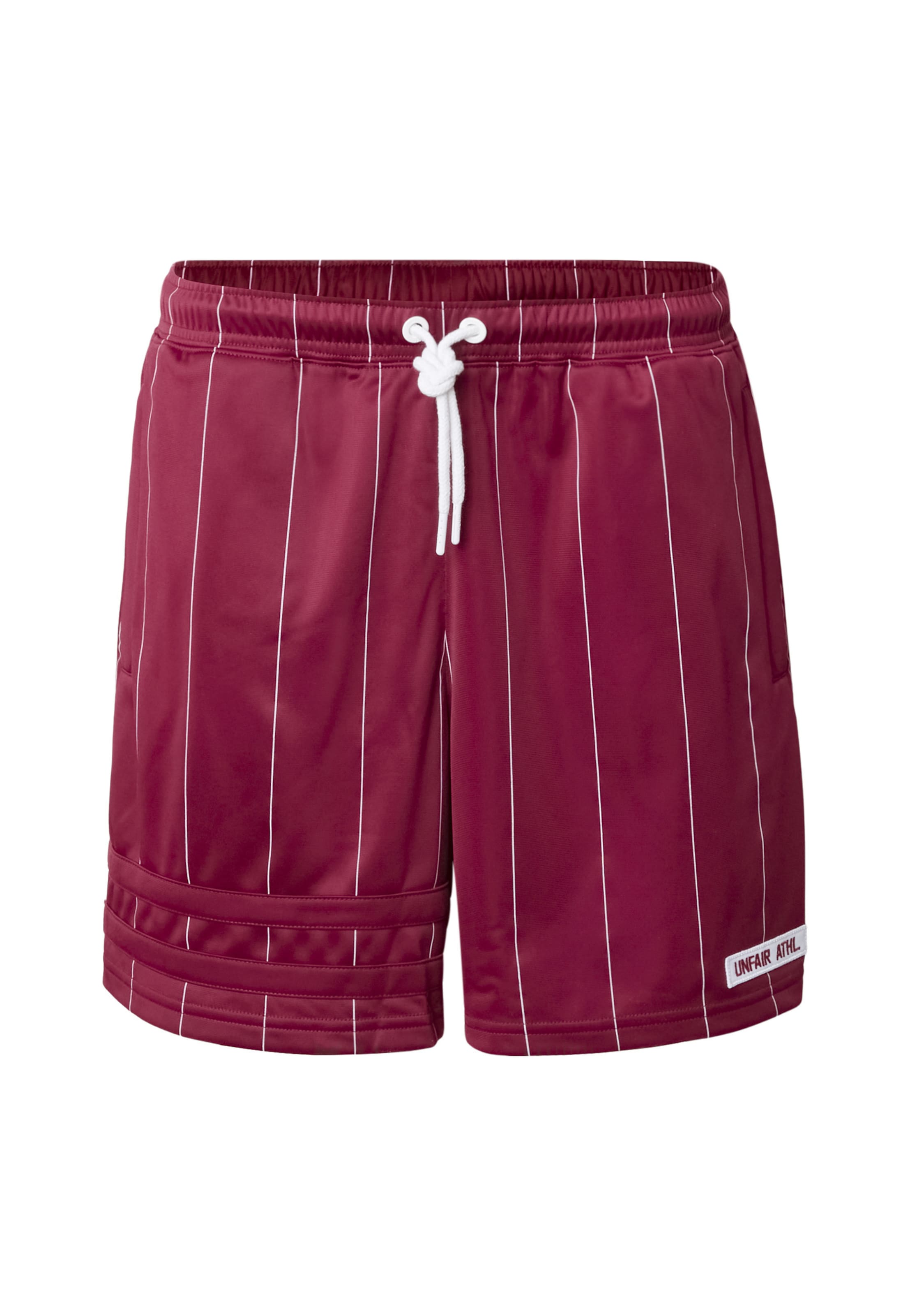 Loosefit Pantaloni sportivi 'DMWU' di Unfair Athletics in rosso: frontale