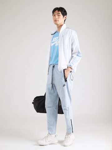 zils Nike Sportswear Pakapēniski sašaurināts piegriezums Bikses