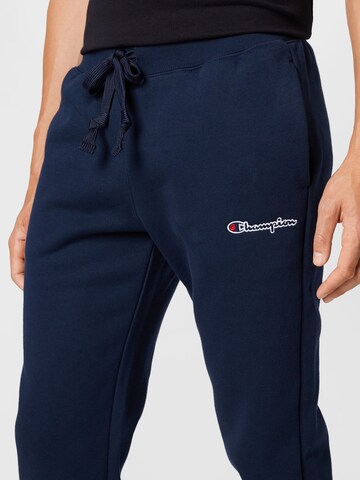 Champion Authentic Athletic Apparel Tapered Broek in Blauw