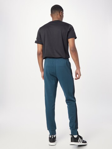 ADIDAS SPORTSWEAR - Tapered Pantalón deportivo 'Essentials' en azul