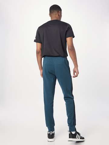 ADIDAS SPORTSWEAR Tapered Παντελόνι φόρμας 'Essentials' σε μπλε