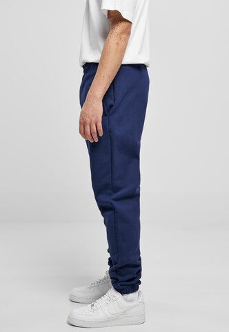 Tapered Pantaloni di Urban Classics in blu