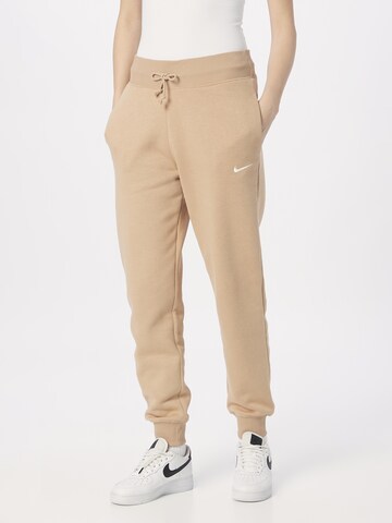 Nike Sportswear Tapered Pants in Beige: front