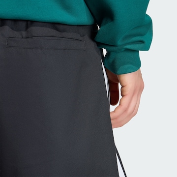 ADIDAS ORIGINALS Loose fit Trousers 'Adicolor' in Black