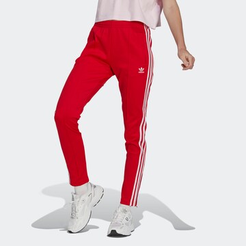 Coupe slim Pantalon ADIDAS ORIGINALS en rouge : devant