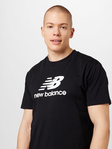 new balance قميص بلون أسود