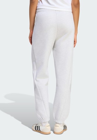 ADIDAS SPORTSWEAR - Tapered Calças de desporto 'Z.N.E.' em cinzento