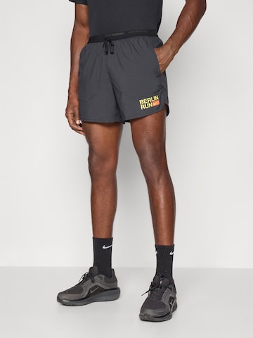 NIKE Ohlapna forma Športne hlače 'CITY MRTH STRIDE' | črna barva: sprednja stran