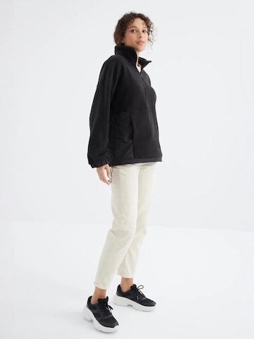 Giacca di pile di Tommy Life in nero
