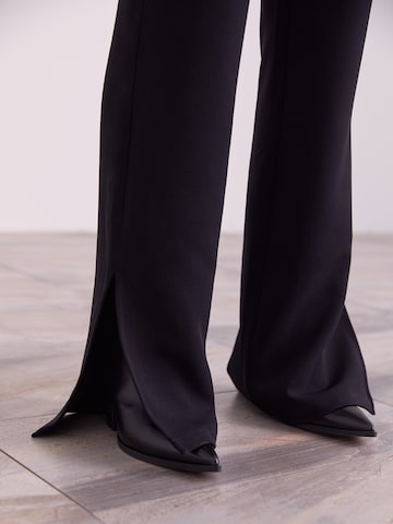 ABOUT YOU x Iconic by Tatiana Kucharova Flared Pants 'Edina' in Black