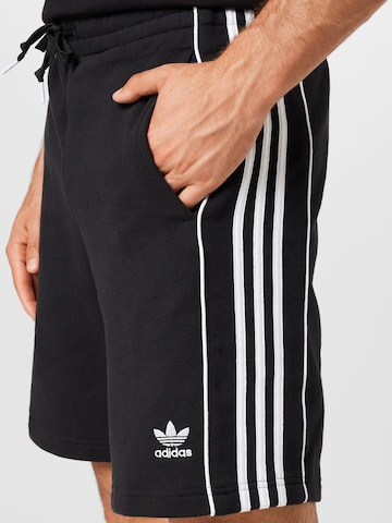 Regular Pantaloni 'Rekive' de la ADIDAS ORIGINALS pe negru