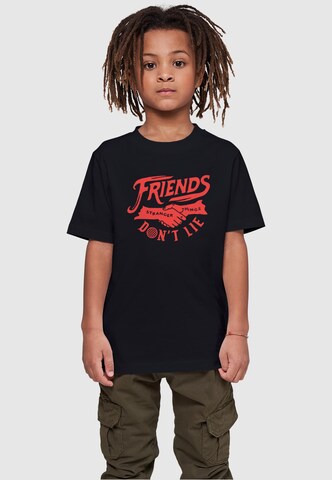 ABSOLUTE CULT Shirt 'Stranger Things - Friends Dont Lie' in Zwart: voorkant