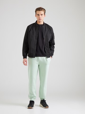 ELLESSE Tapered Hosen 'Cannaregio' in Grün