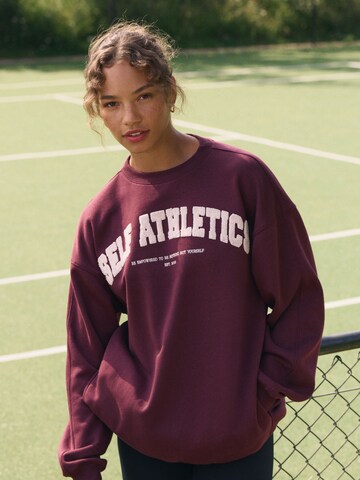 Sweat-shirt self. en rouge