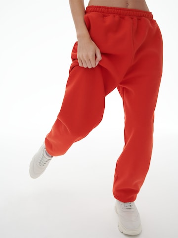 LENI KLUM x ABOUT YOU Loose fit Pants 'Lea' in Red: front