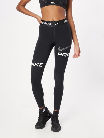 NIKE Skinny Sportbroek in Zwart: voorkant