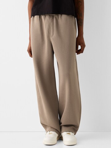 Bershka Wide leg Trousers in Beige: front