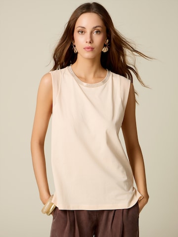 Top di oltre in bianco