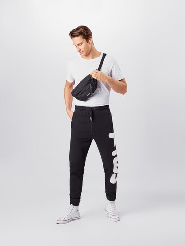 Tapered Pantaloni sport de la FILA pe negru