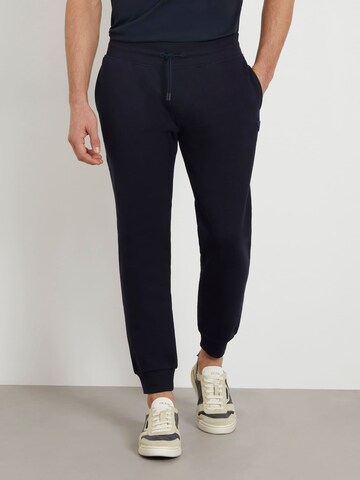 GUESS Tapered Pants in Blue: front