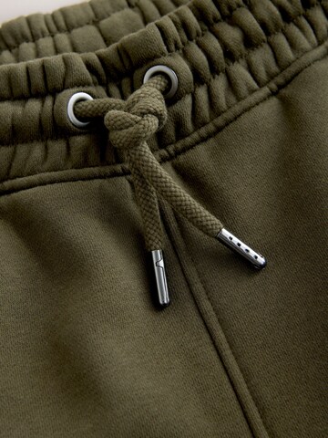 Next Tapered Housut värissä vihreä