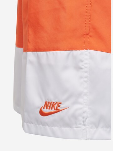 Nike Sportswear Štandardný strih Nohavice - oranžová