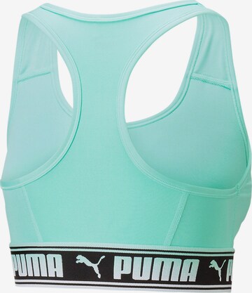 PUMA Bustier Biustonosz sportowy w kolorze zielony