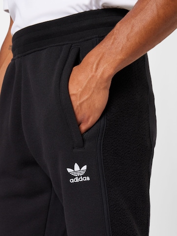 ADIDAS ORIGINALS Tapered Pants 'Trefoil Essentials+ Reverse Material' in Black