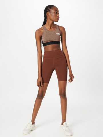 Girlfriend Collective Skinny Sporthose in Braun