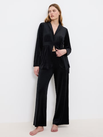 TRIUMPH - Calças de pijama ' Sensual Velour Wide Leg ' em preto