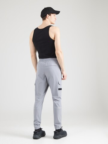 UNDER ARMOUR Ozke Športne hlače 'Tech Utility' | srebrna barva