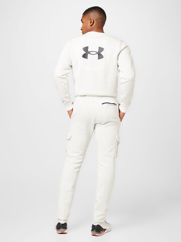 Effilé Pantalon de sport UNDER ARMOUR en blanc