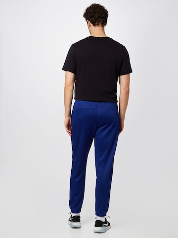 Nike Sportswear Zwężany krój Spodnie w kolorze niebieski