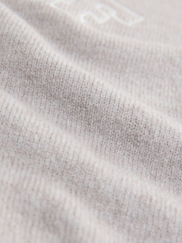 Pull-over self. en beige