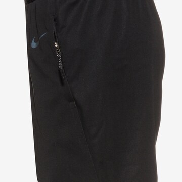 Regular Pantalon de sport 'RUN' NIKE en noir