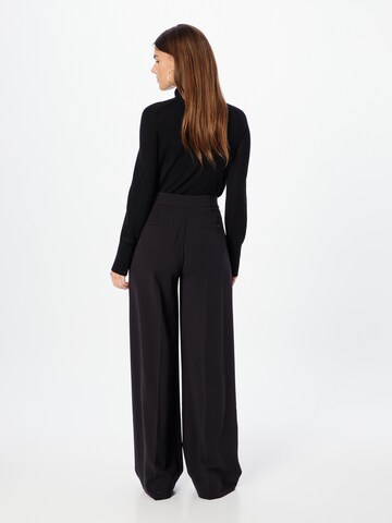 Wide leg Pantaloni con pieghe di Calvin Klein in nero