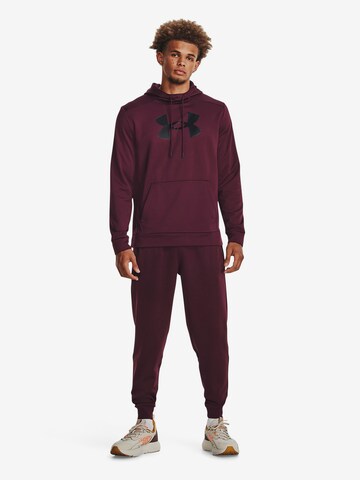 UNDER ARMOUR Tapered Sportbroek in Rood