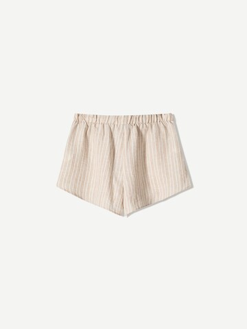 Bershka Normalny krój Spodnie w kolorze pomarańczowy