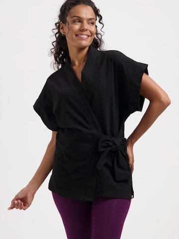 Urban Goddess Yoga & Activewear Sporttop 'Yumea Yoga & Pilates' in Schwarz