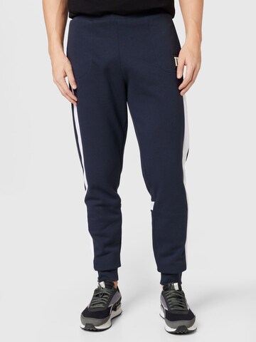 11 Degrees Tapered Trousers in Blue: front