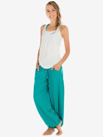 Winshape Ohlapna forma Športne hlače 'WTE3' | zelena barva