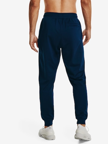 Effilé Pantalon de sport UNDER ARMOUR en bleu