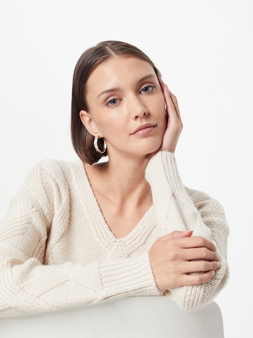 ABOUT YOU Sweater in Beige