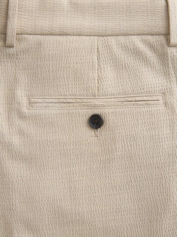 Loosefit Pantaloni con piega frontale di Next in grigio