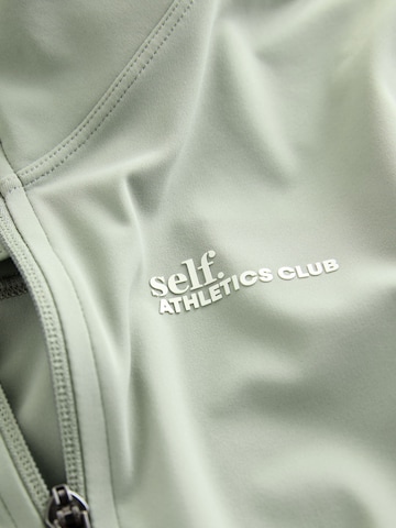 Cardigan self. en vert